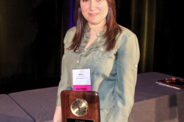 Dr. Maria Pieters holds the 2024 Distinguished Service Award.